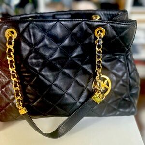 Micheal’s Kor’s quilted handbag with gold chain handles medium size. Like new